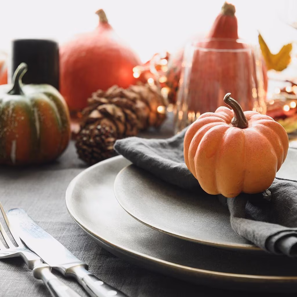 Decorate for Halloween with flowers and pumpkins